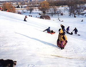 Gita finds her boy on the sledding hill.